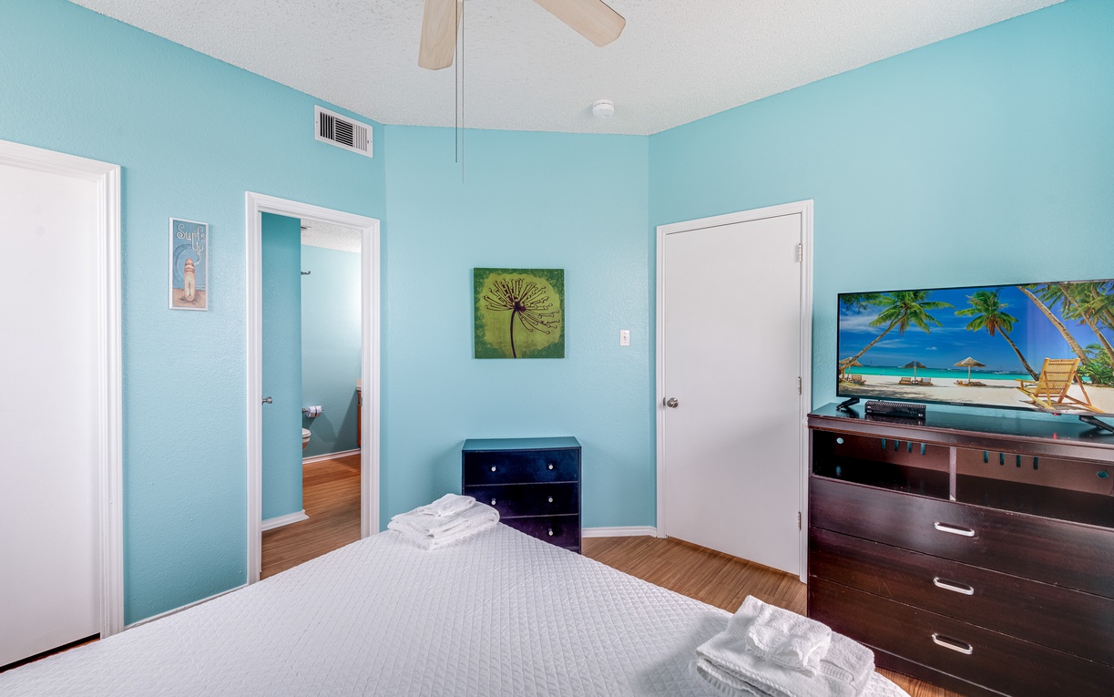 Relax in your bright, coastal-inspired bedroom with tropical TV viewing and fresh beach vibes throughout.