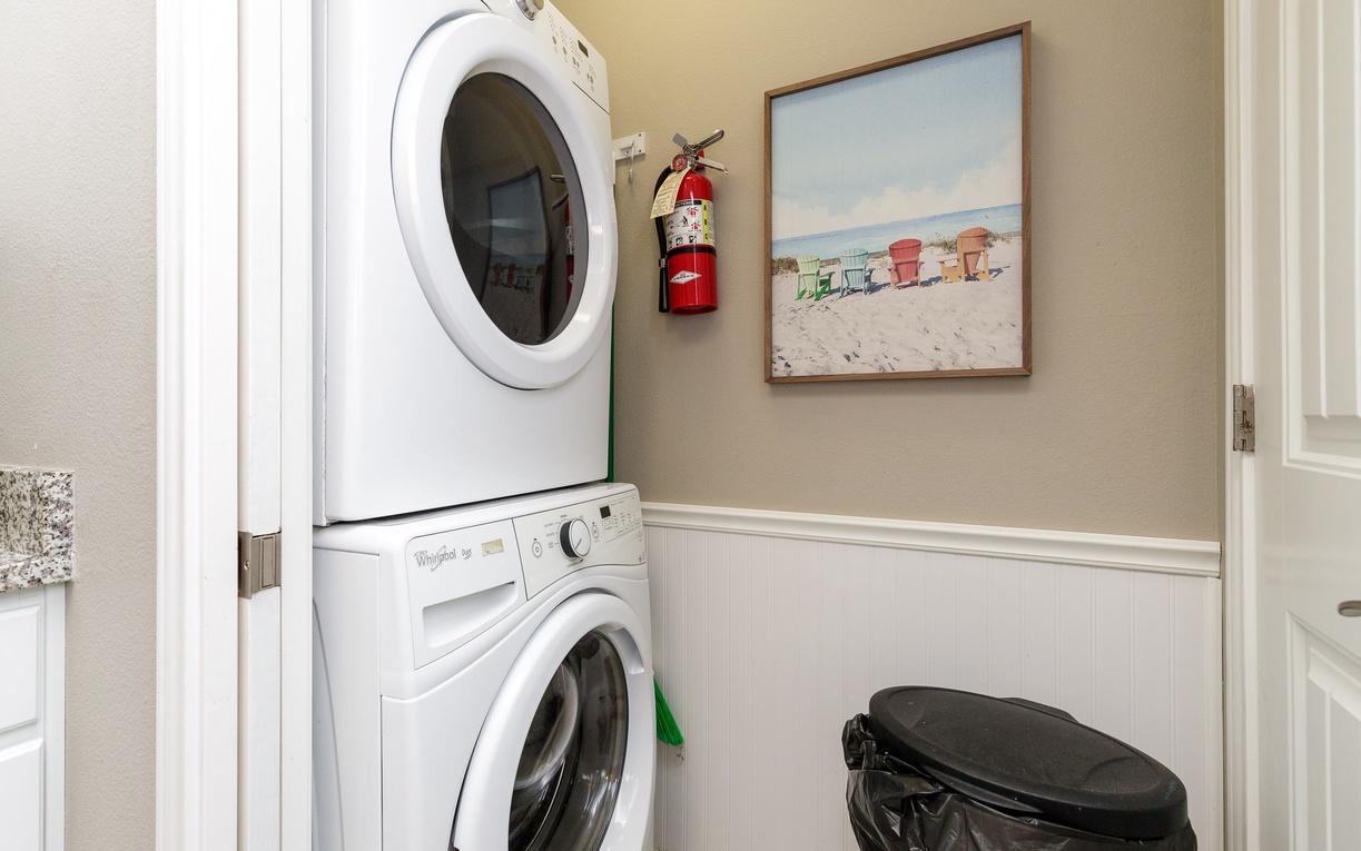 Your dedicated laundry space keeps vacation wardrobes fresh with stacked washer and dryer, perfectly sized for your stay.
