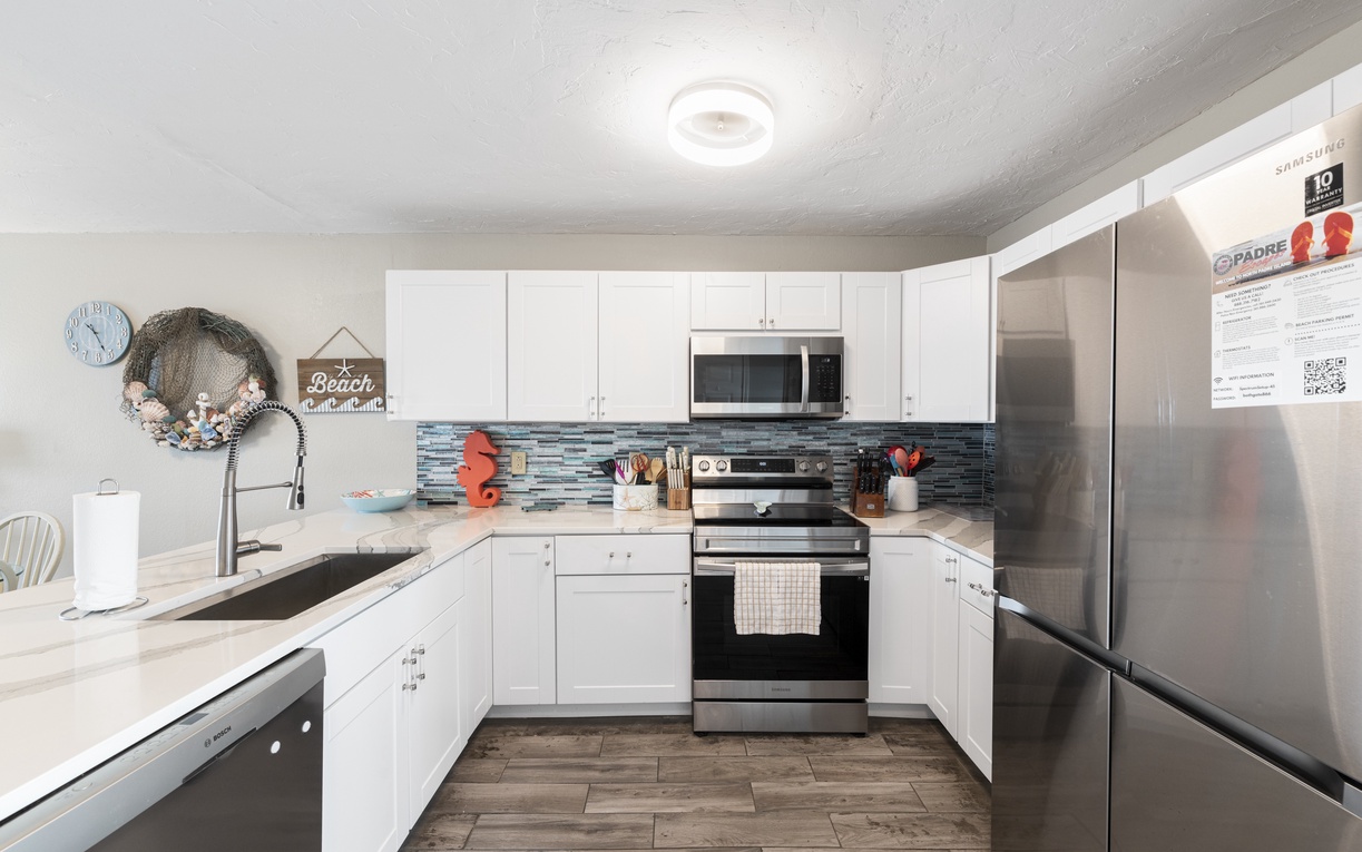 Your fully equipped kitchen features stainless steel appliances, coastal charm, and everything you need to create memorable meals together.