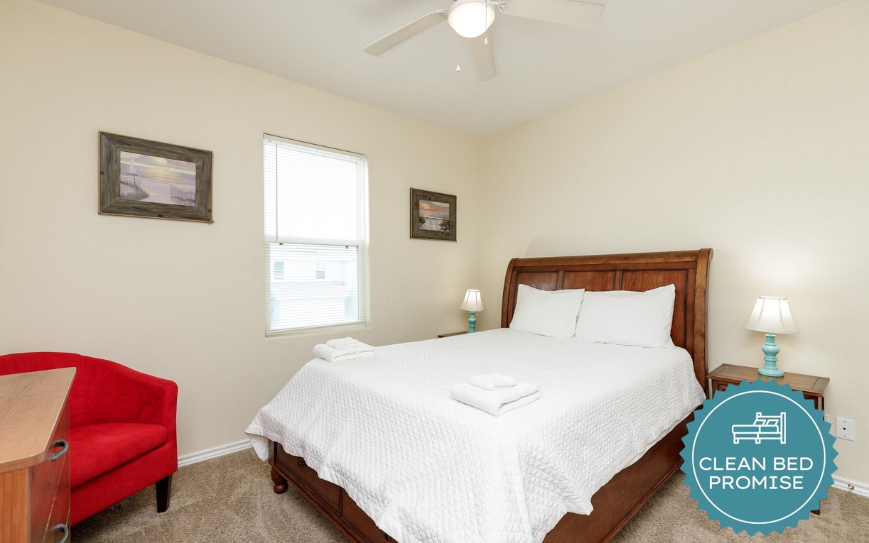 Drift into peaceful sleep in this comfortable bedroom with crisp linens and warm wood tones.