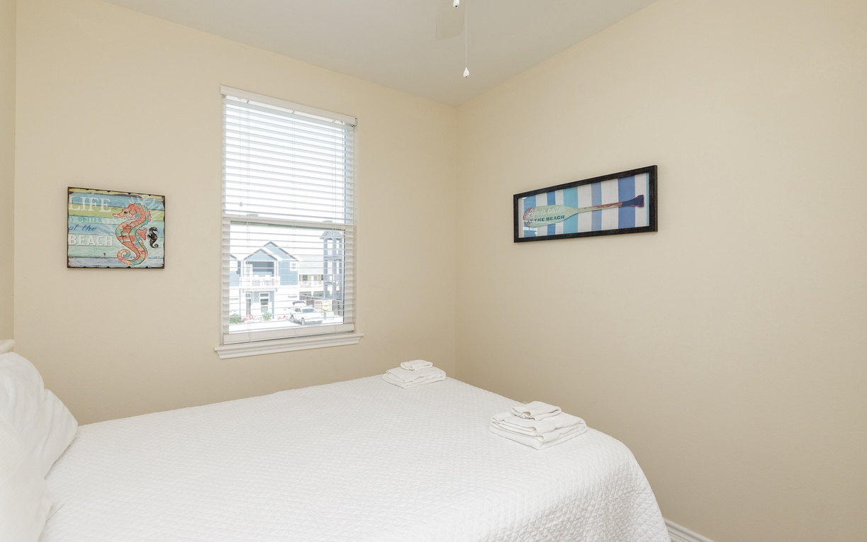 Relax in your peaceful bedroom featuring a comfortable queen size bed