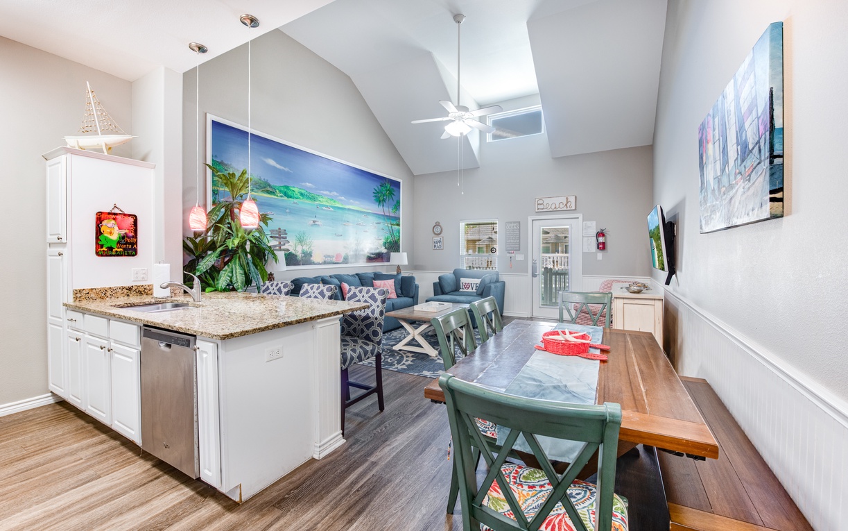 Step into your bright, open living space where tropical vibes meet modern comfort—perfect for relaxing after beach adventures.