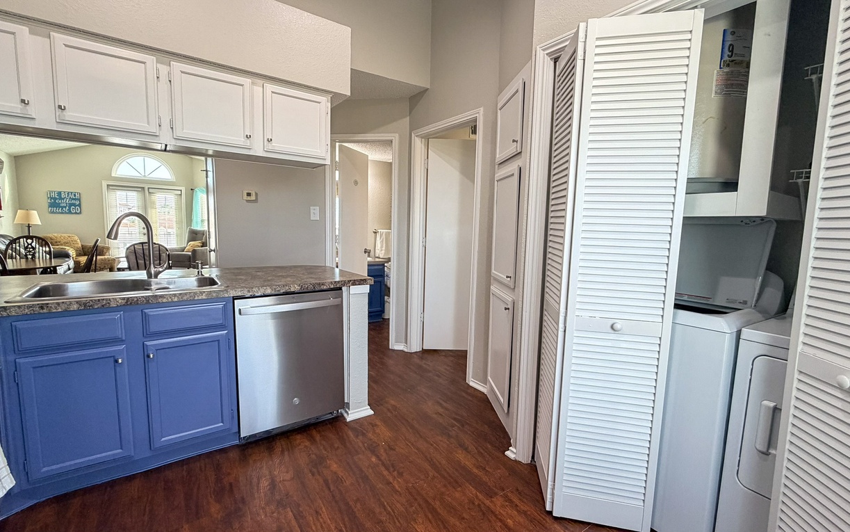 Your fully equipped kitchen features granite countertops, stainless appliances, and convenient in-unit laundry facilities for a comfortable home-away-from-home experience.