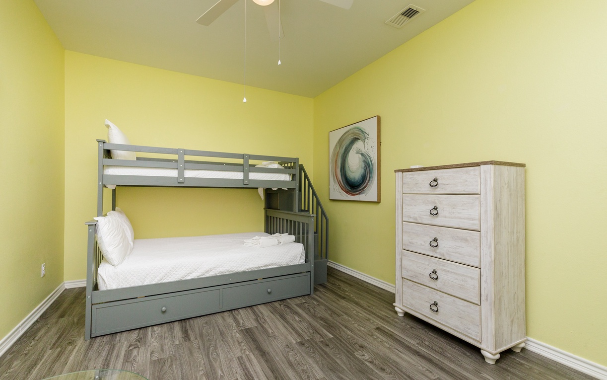 Your kids will love this bright bedroom with sturdy bunk beds and plenty of storage for their vacation adventures.