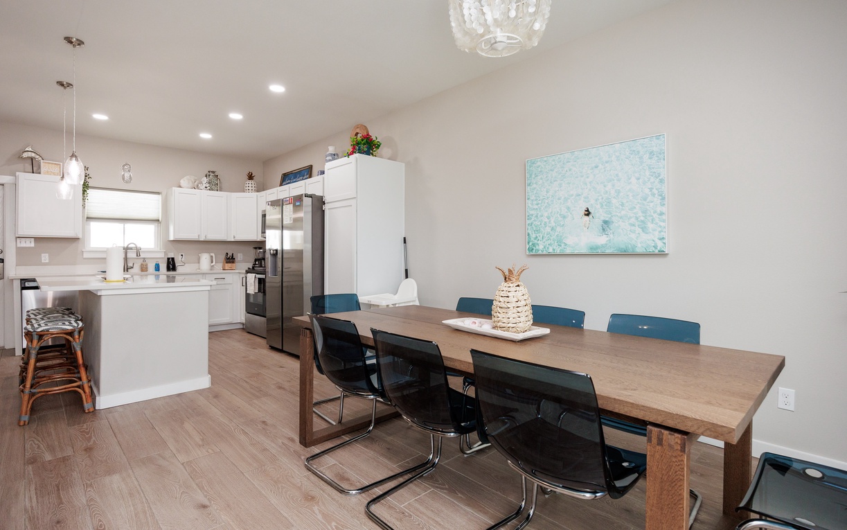 Gather your group around this spacious dining table, perfectly positioned between your fully-equipped kitchen and stylish living areas for memorable meals.