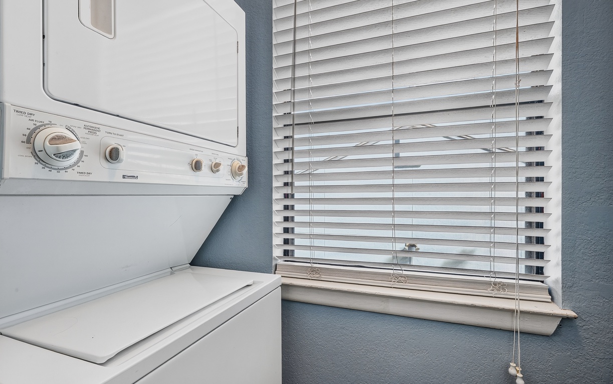 You'll love the convenience of in-unit laundry—a stackable washer and dryer tucked neatly into this space means you can pack light and refresh your wardrobe whenever you need.