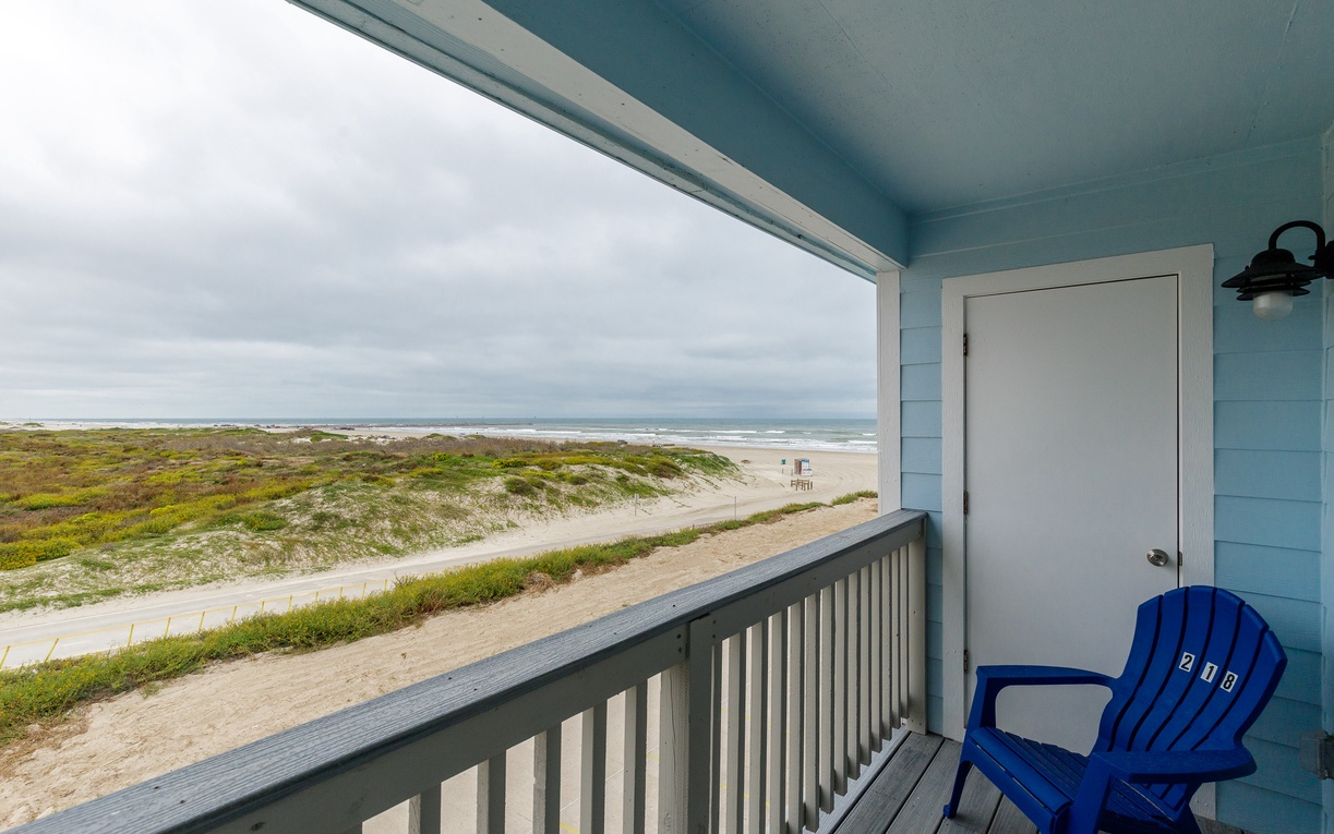 Step onto your private covered balcony where ocean breezes and endless beach views create your perfect coastal retreat.