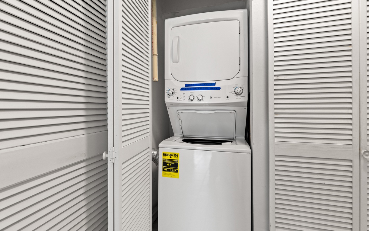 Your own in-unit washer and dryer makes packing light a breeze, tucked neatly away in this convenient closet space.