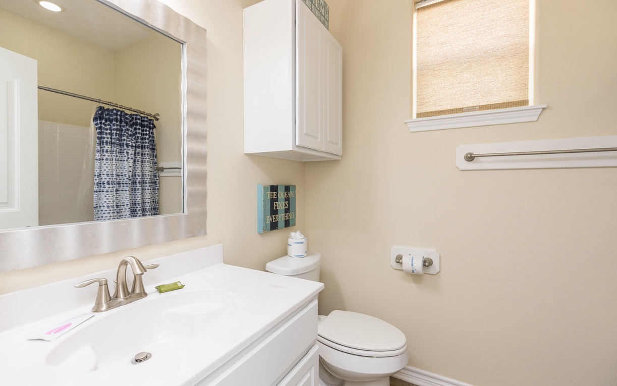 Step into your bright, modern bathroom with fresh linens and thoughtful touches waiting for your arrival.