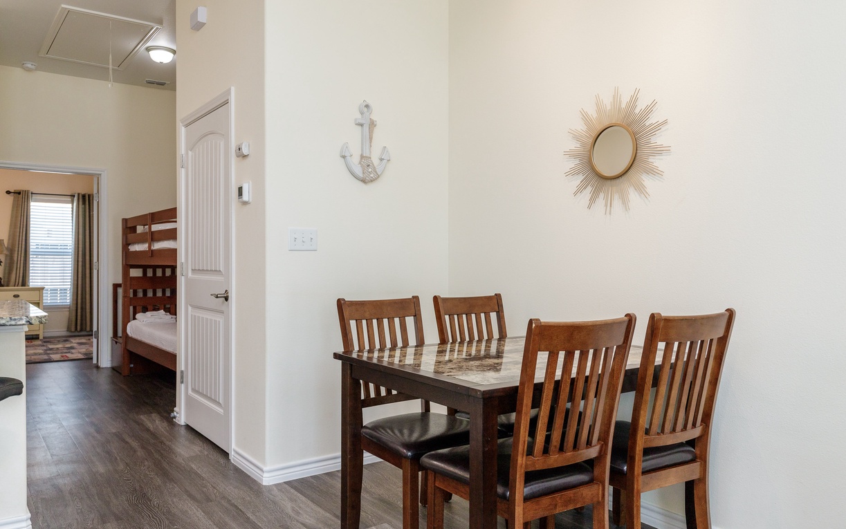 Gather around your elegant dining table for memorable meals with loved ones in this bright, welcoming space.