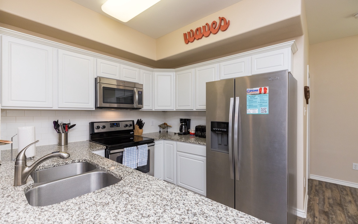 Your fully equipped kitchen features granite countertops, stainless steel appliances, and everything you need to prepare delicious meals during your stay.