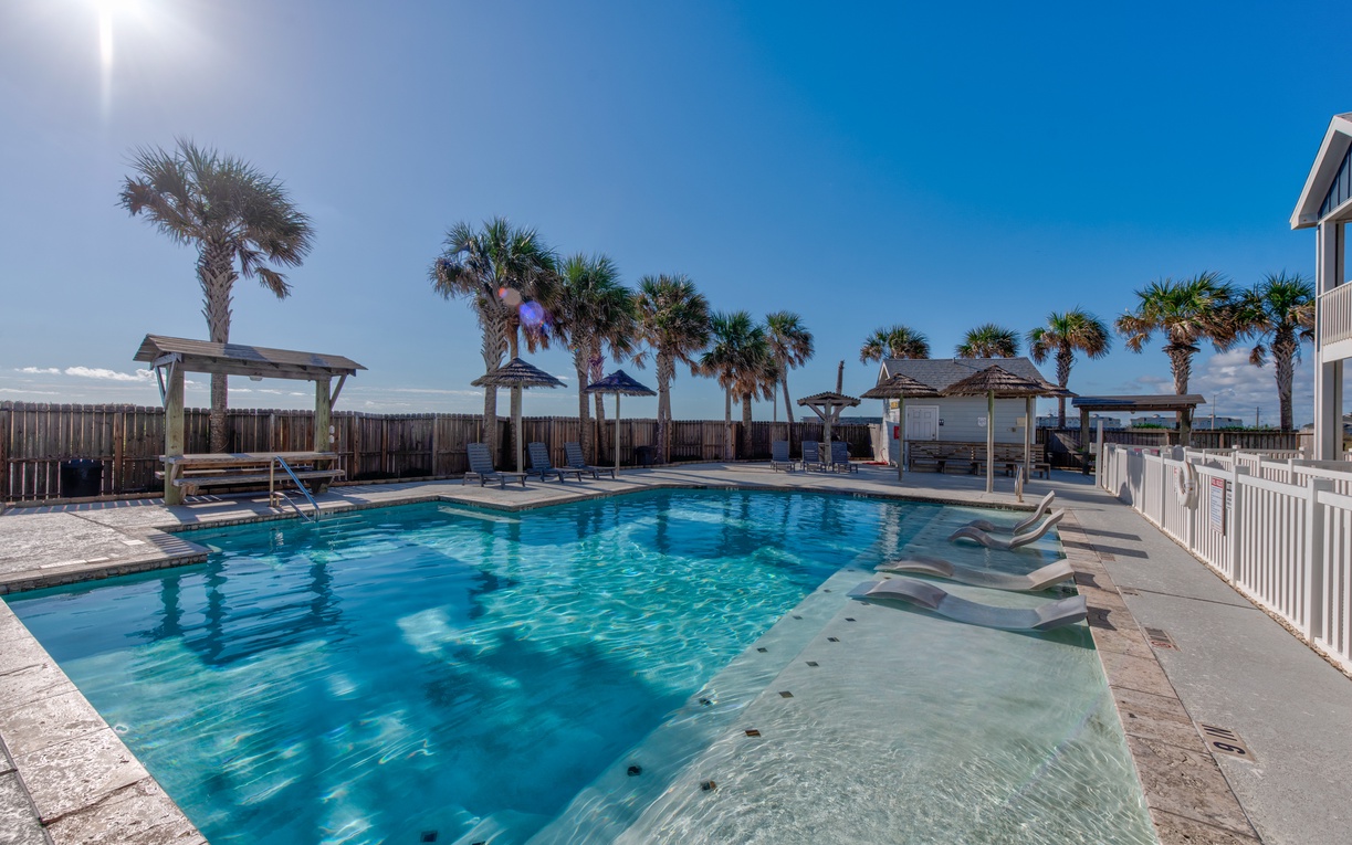 Dive into crystal-clear waters surrounded by swaying palms and endless blue skies in your private tropical paradise.