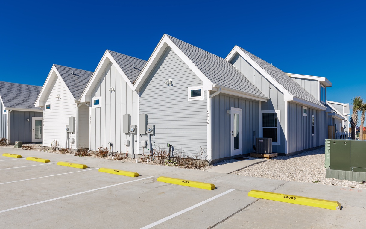 Modern coastal cottages with dedicated parking spaces offer convenient arrival to your beachside retreat.