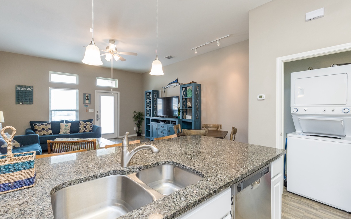 Your open-plan kitchen flows seamlessly into the cozy living area, perfect for preparing meals while staying connected with everyone.