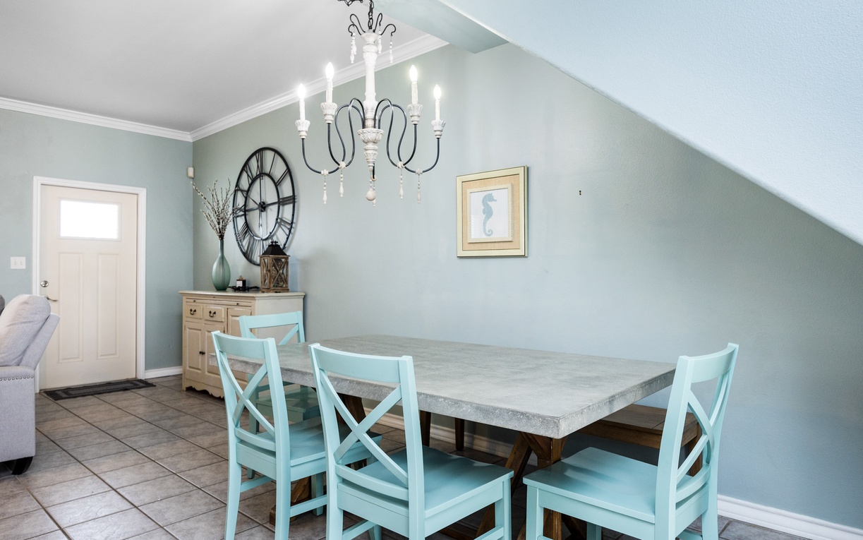 Gather around this elegant dining table for memorable meals together in your charming retreat.