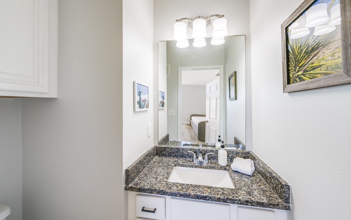 Fresh up in your private vanity area with granite countertops and thoughtful amenities ready for your daily routine.