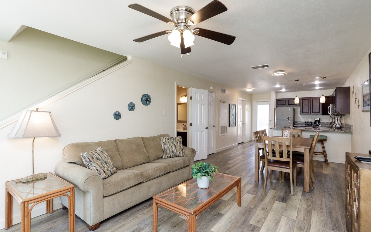 Relax in your spacious open-concept living space with comfortable seating and sleeper sofa
