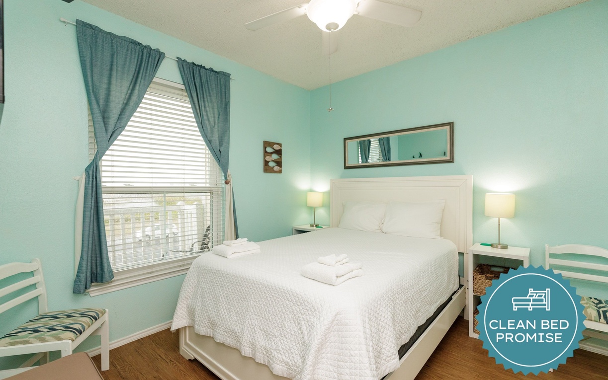 Drift off in this tranquil bedroom where soft mint walls and crisp white linens create your peaceful retreat.