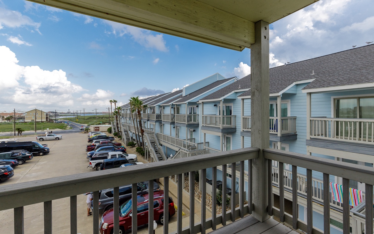 Step onto your private balcony and take in the coastal property views and convenient parking below.