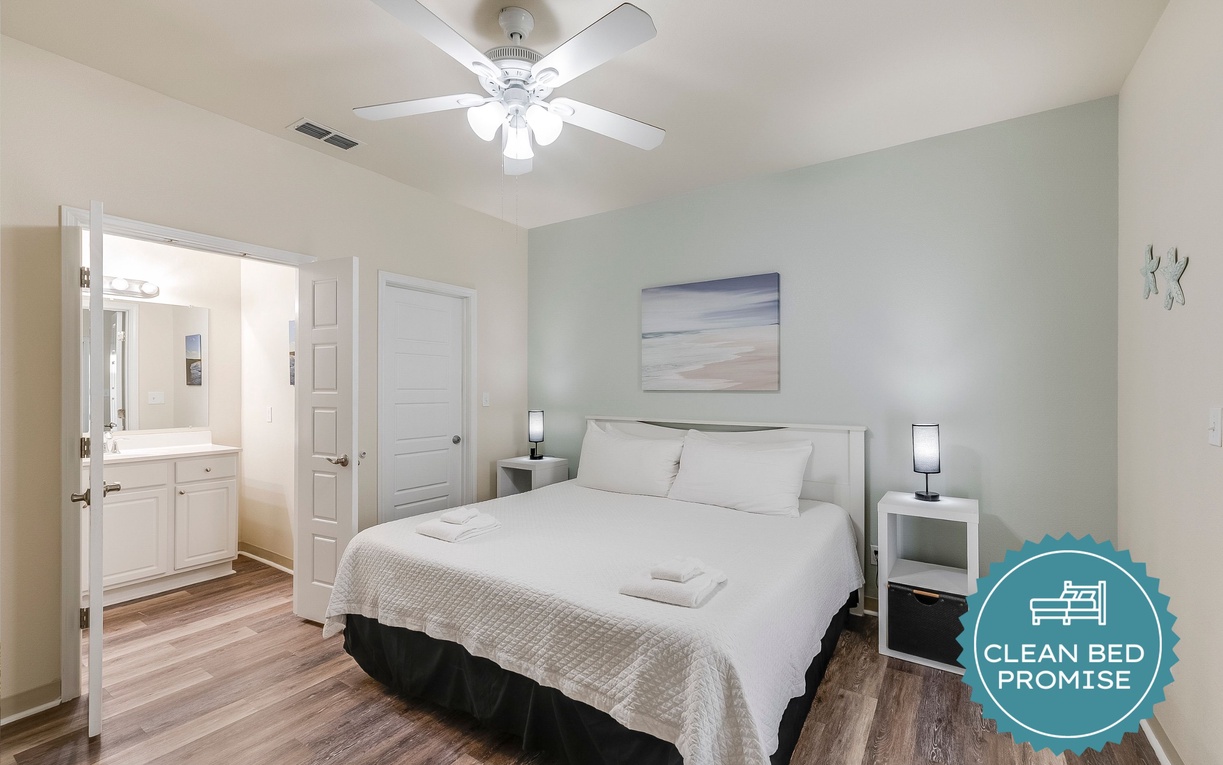 Sink into crisp linens and let the gentle ceiling fan create the perfect sleep sanctuary.