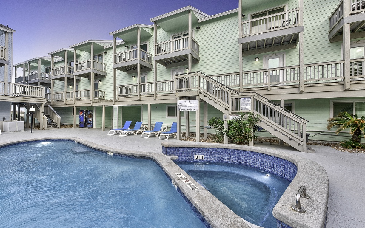 Unwind in your private hot tub after poolside lounging, surrounded by coastal architecture and endless relaxation possibilities.