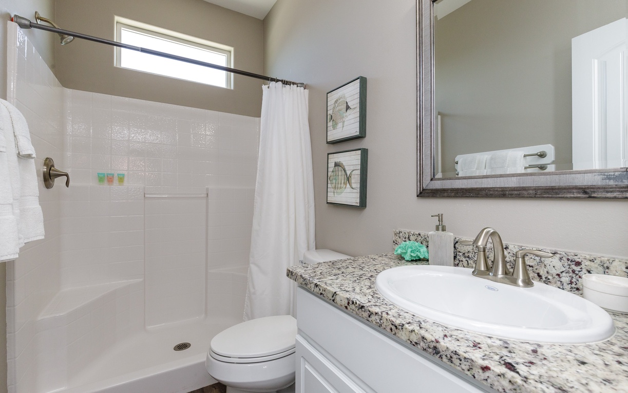 Refresh in your beautifully appointed bathroom with granite countertops, spacious shower, and thoughtful amenities to start your day perfectly.