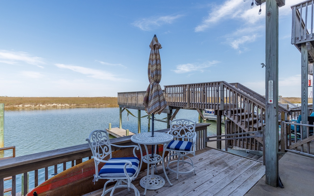 Relax on your private deck overlooking calm waters, where morning coffee and sunset cocktails become unforgettable moments.