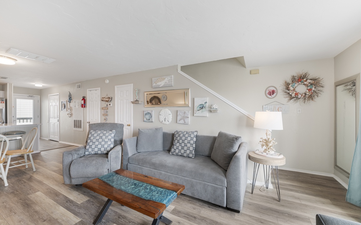 Kick back on the cozy, sink-right-in couch—the perfect spot to unwind after a beach day. When night comes you can pull out the sleeper sofa for two additional guests to sleep on.