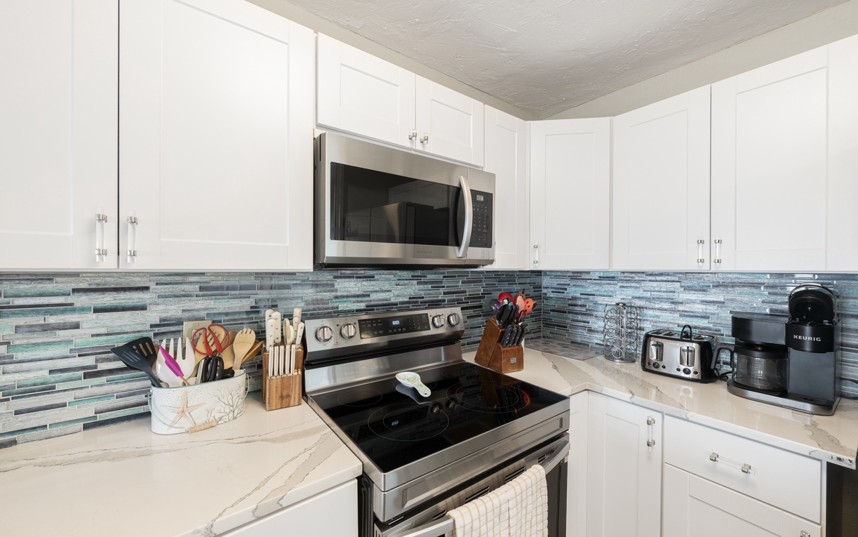 Your fully-equipped kitchen awaits with modern appliances, ample counter space, and everything needed to create memorable meals during your stay.