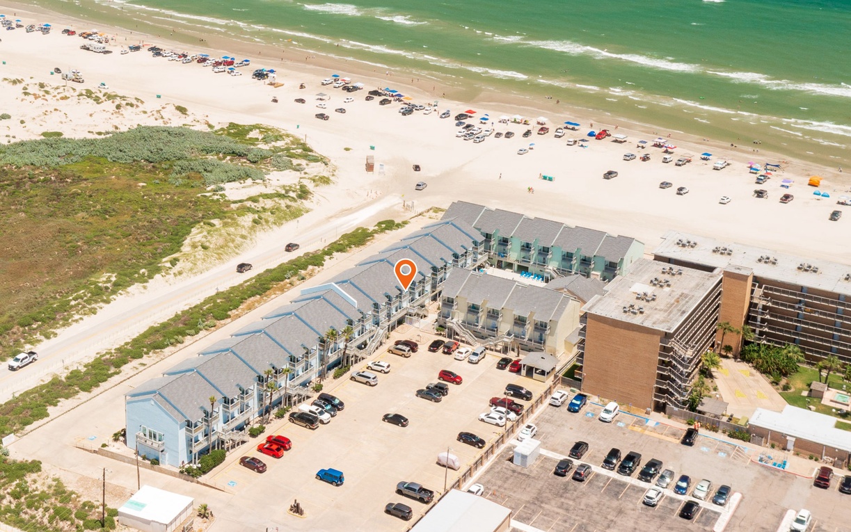 Beachfront property complex with direct beach access and convenient parking.