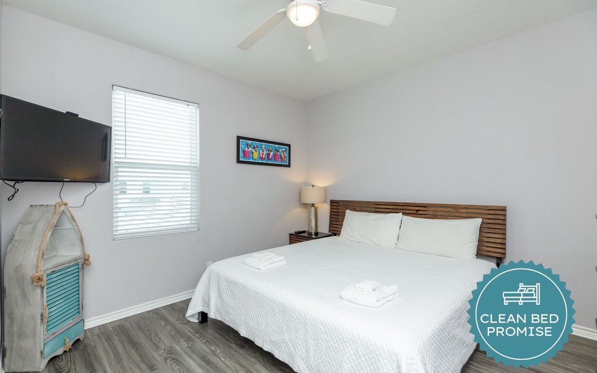Relax in your comfortable bedroom with crisp linens, modern amenities, and natural light streaming through the window.