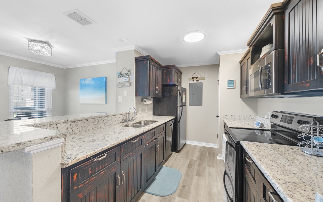 Your gourmet kitchen awaits with granite countertops, modern appliances, and ample space for creating memorable meals together.
