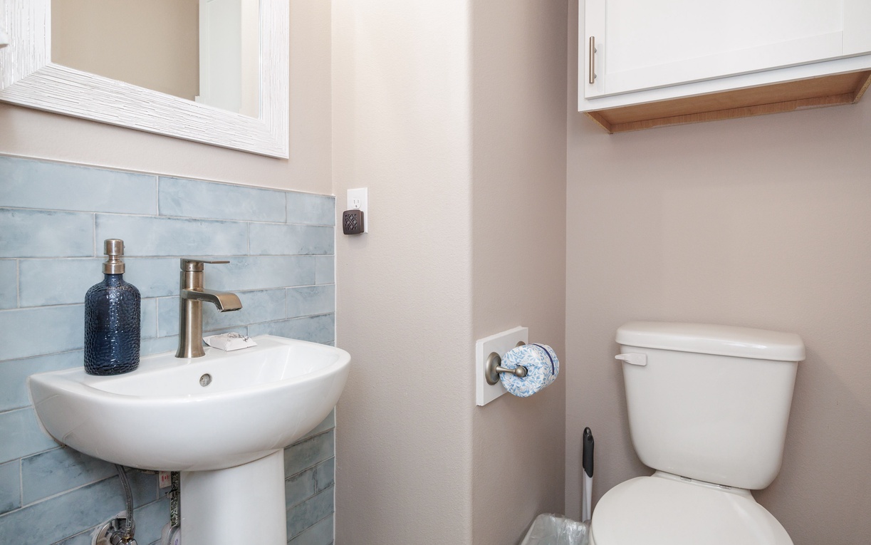 Your private half-bath features elegant fixtures and thoughtful touches, creating a comfortable space for you and your guests.