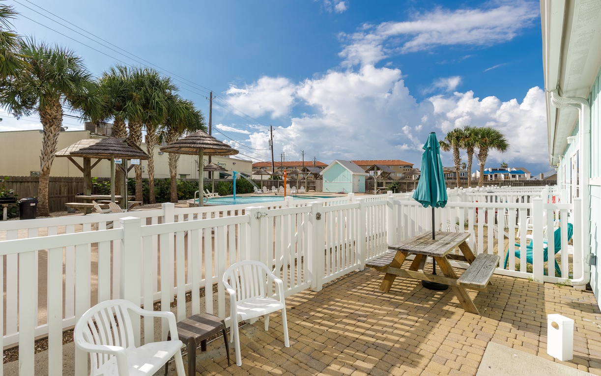 Your private patio offers the perfect spot to sip morning coffee while enjoying tropical breezes and charming neighborhood views.