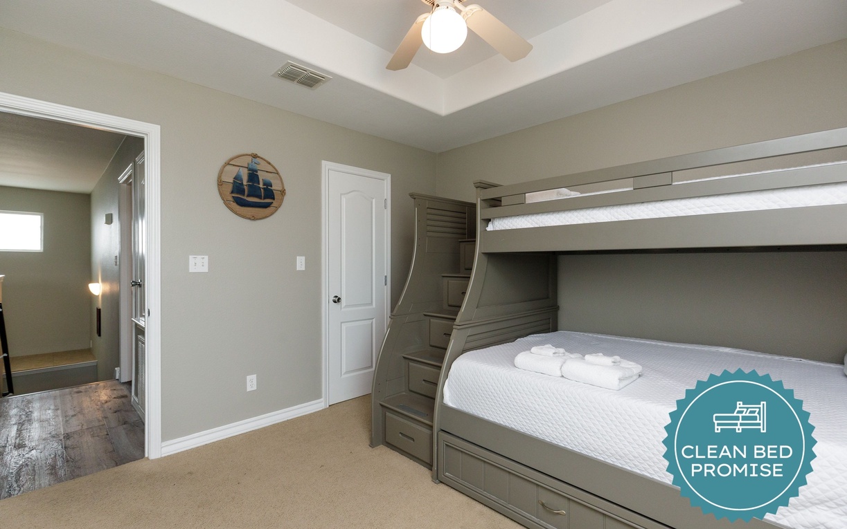 Your kids will love this spacious bunk room with built-in storage and nautical touches, complete with fresh linens awaiting their arrival.