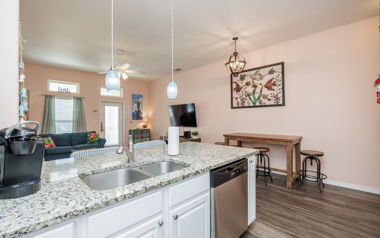 Your open-concept kitchen flows seamlessly into the cozy living area, perfect for connecting with family while cooking.