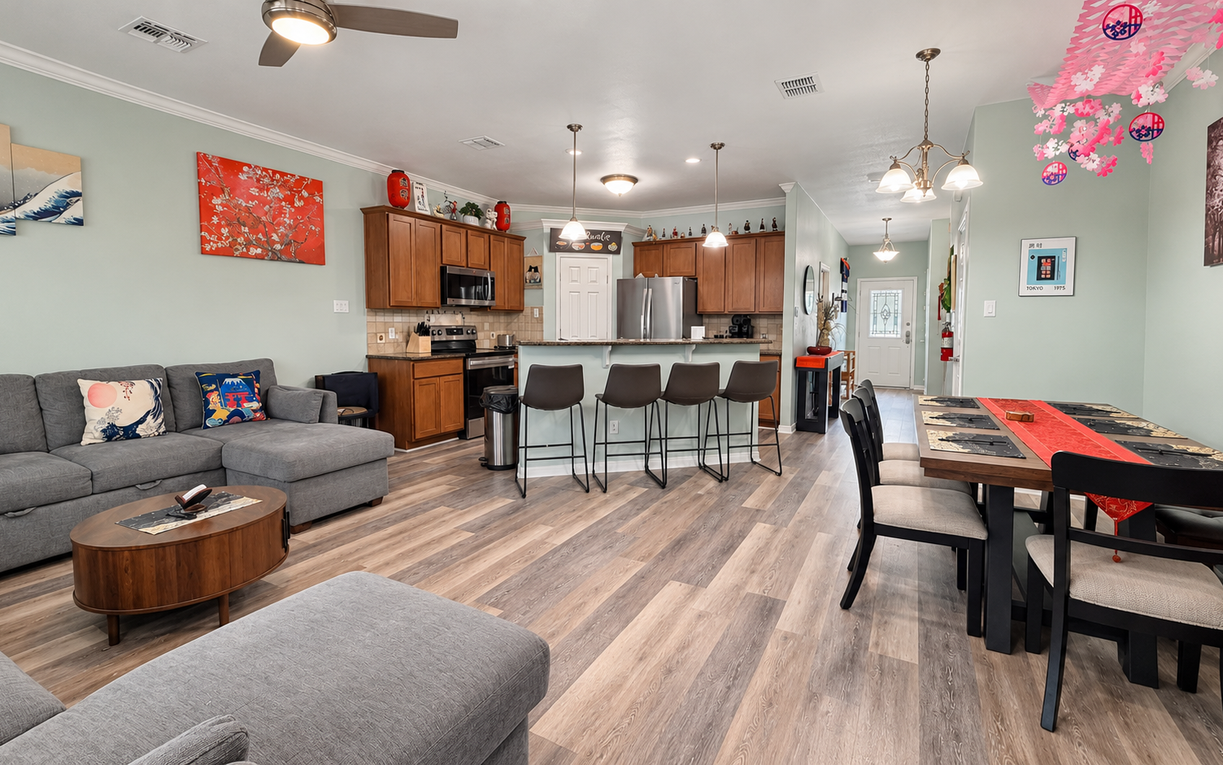 Gather around the spacious kitchen island, perfectly designed for morning coffee or evening meals. Modern appliances, warm wood cabinetry, and thoughtful touches make this your home away from home.