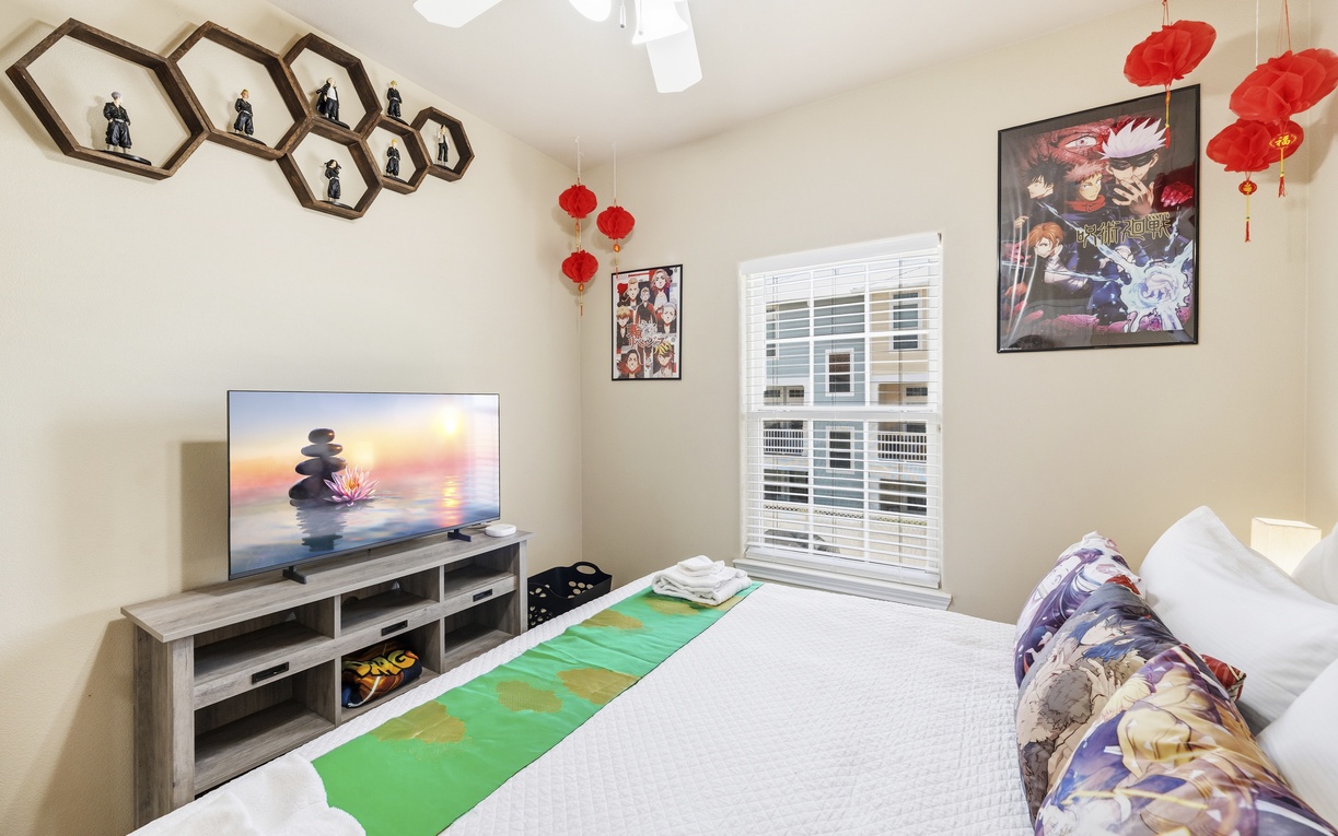 Unwind in your themed bedroom with a plush bed, large TV, and vibrant décor. Ceiling fan keeps you cool while you enjoy your favorite shows.