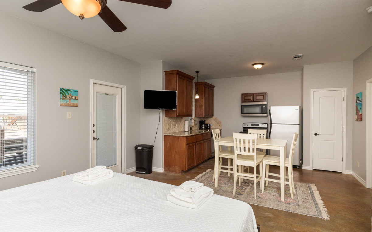 Your spacious studio combines sleeping, cooking, and dining in one thoughtfully designed space with modern amenities and coastal touches.