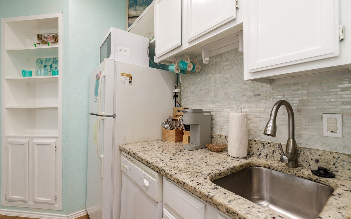 Your fully equipped kitchen features granite counters, stainless appliances, and thoughtful touches that make cooking feel like home.