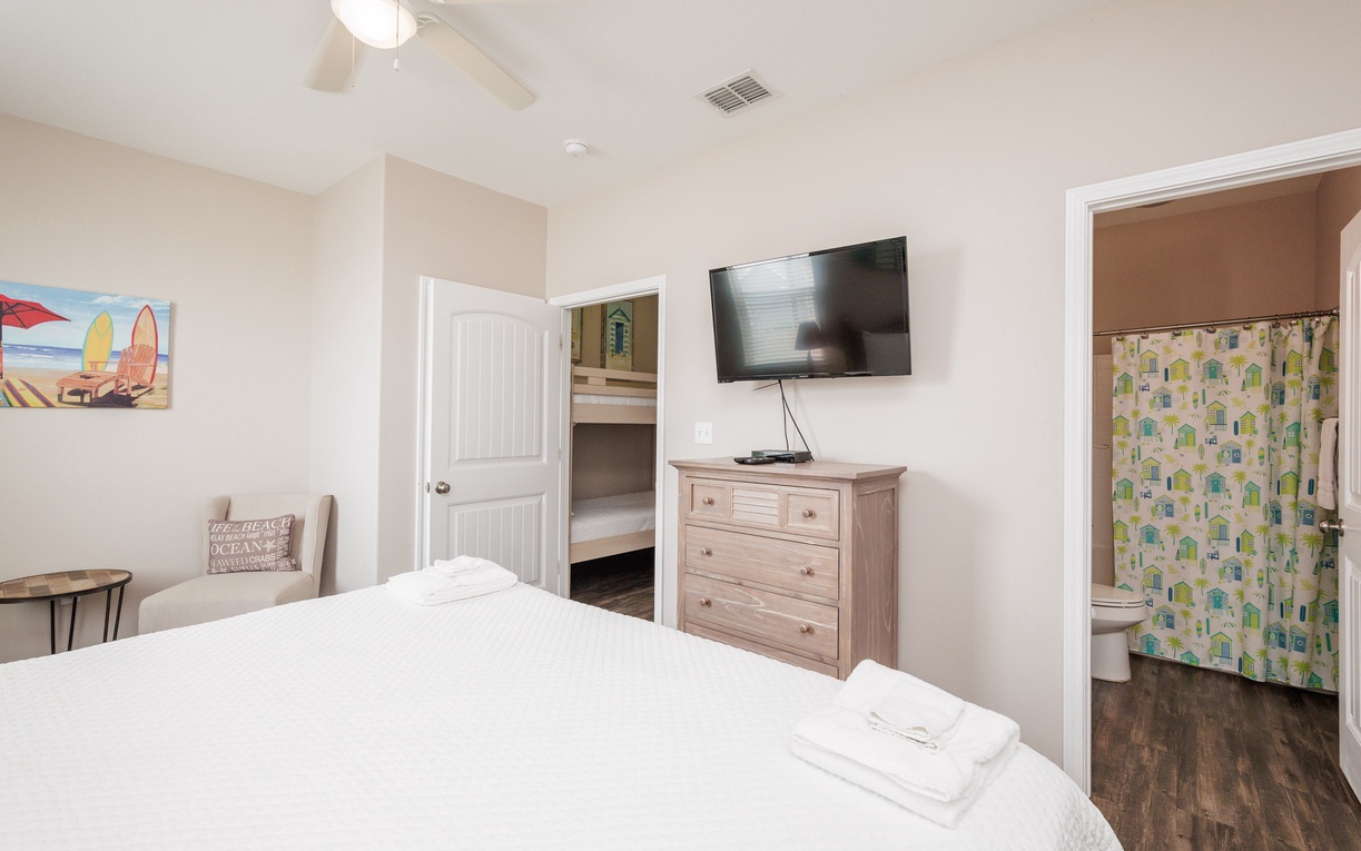 Relax in your bright bedroom with comfy linens, entertainment center, and convenient bunk nook for extra guests.