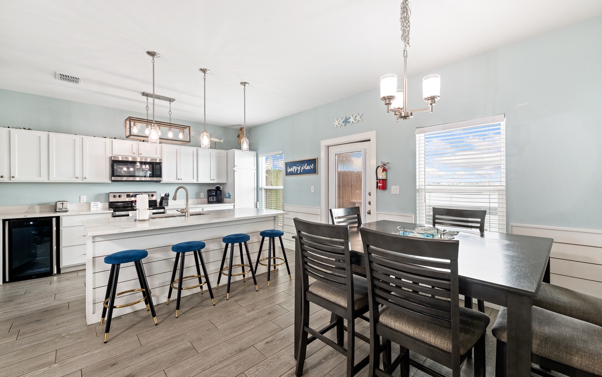 Gather around the island for morning coffee or share a home-cooked meal at the dining table—this bright, open kitchen invites you to relax and make memories together.