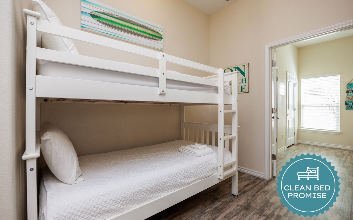 Your kids will love this cozy bunk bed room with crisp white linens and plenty of space to play and rest after fun-filled days.
