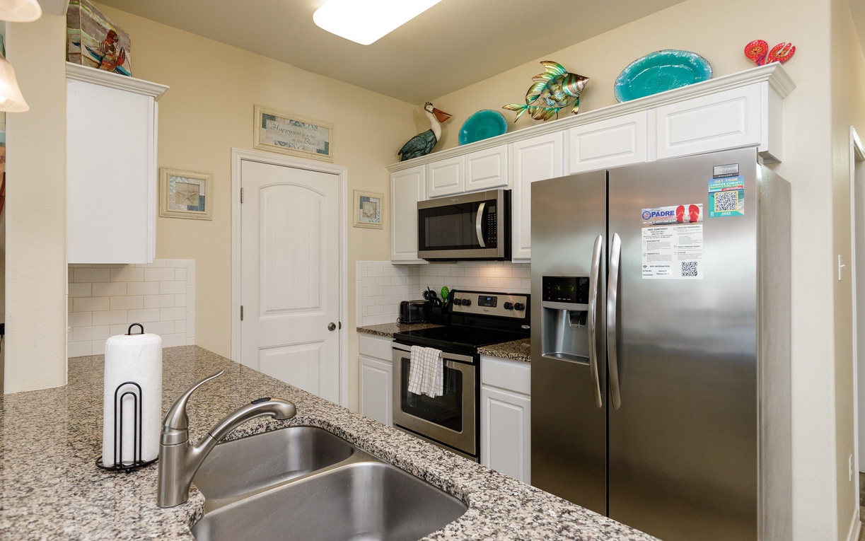 Your fully equipped kitchen features granite counters, stainless appliances, and everything you need for home-cooked meals during your stay.