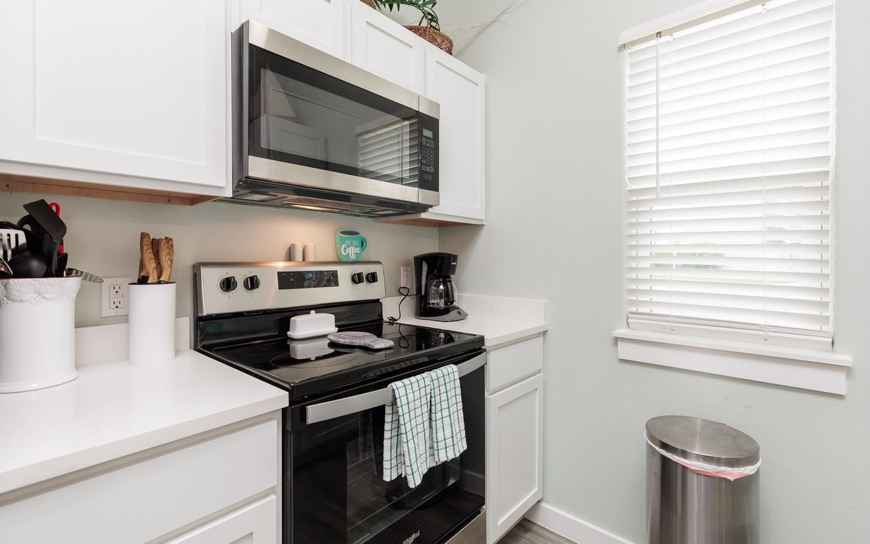 Your fully equipped kitchen awaits with modern appliances and bright natural light—perfect for preparing meals during your stay.