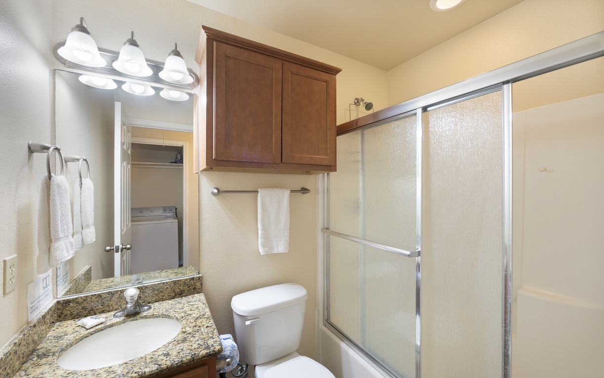 Your private bathroom features granite countertops, fresh towels, and a walk-in shower with glass doors—everything you need to refresh after your adventures.