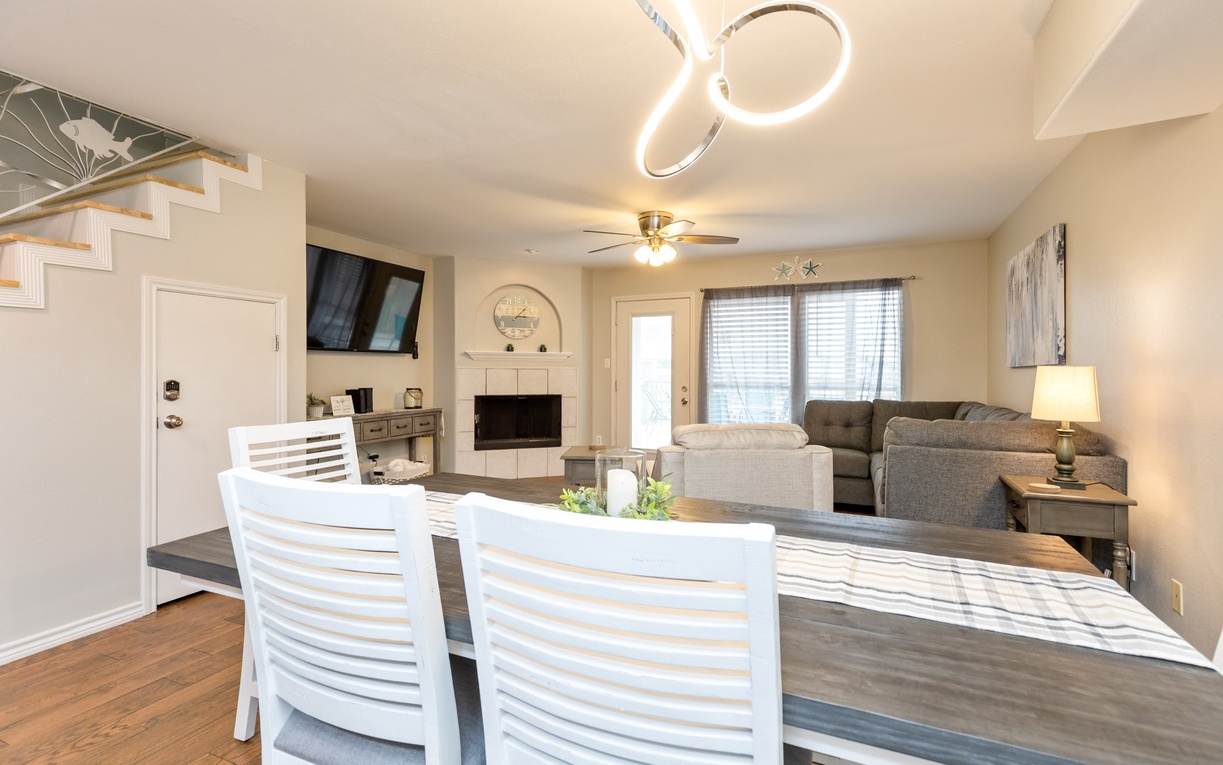 Gather around this welcoming dining table where shared meals become treasured memories, with cozy living space perfect for relaxation.