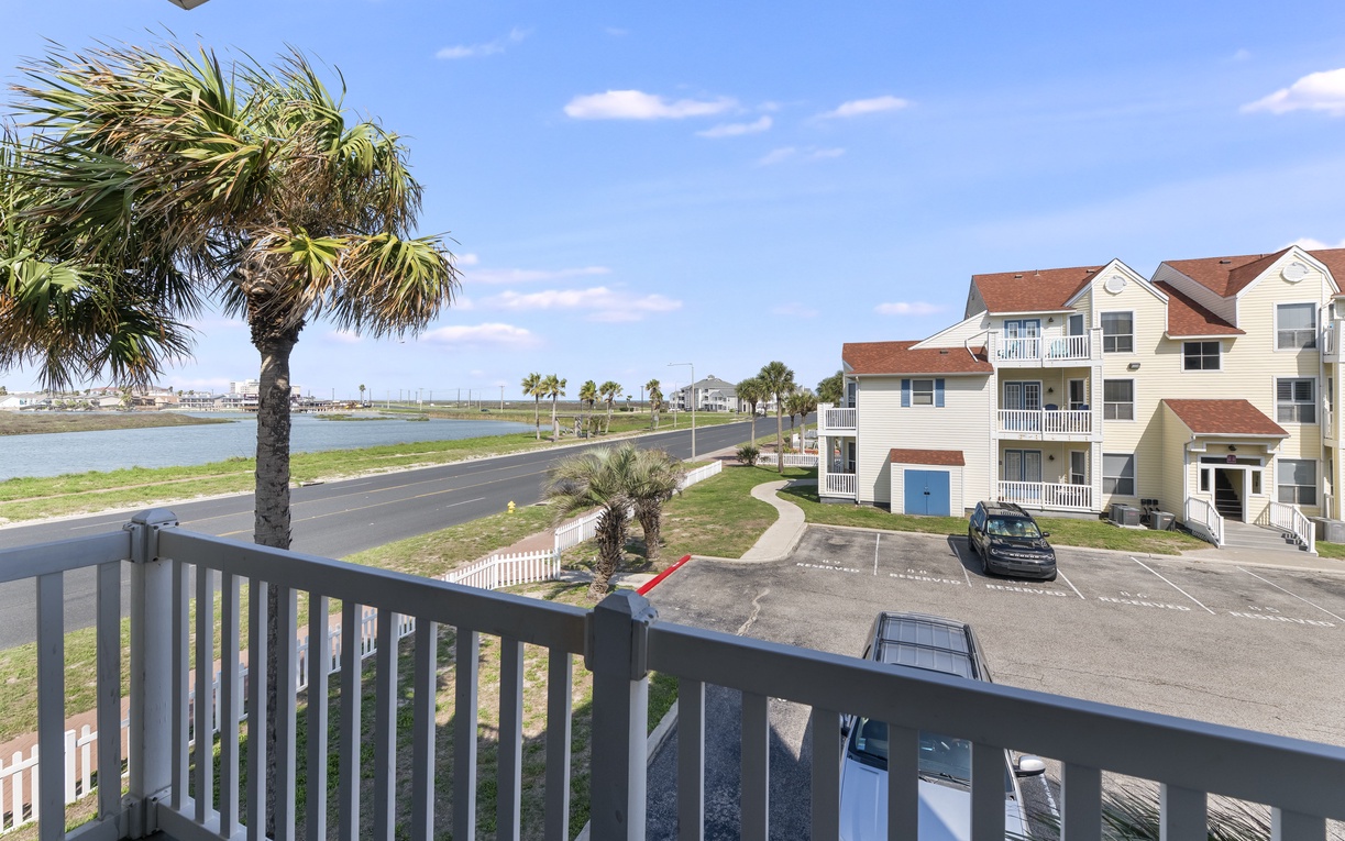 Relax in your private balcony chairs while enjoying peaceful views of the colorful neighborhood below.