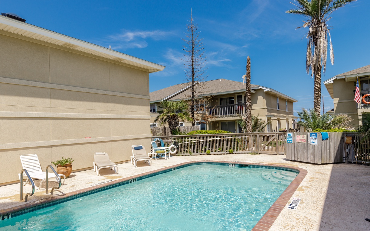 Dive into crystal-clear waters in your private pool sanctuary, surrounded by swaying palms under endless blue skies.