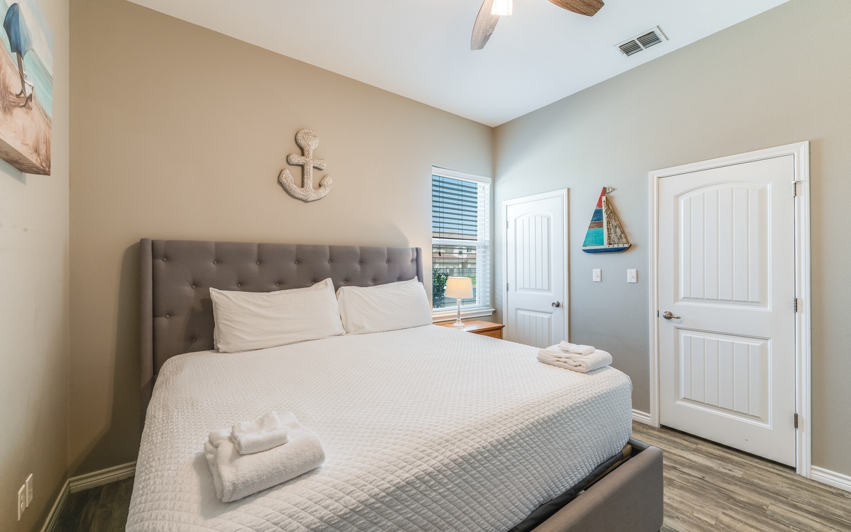 Drift into peaceful sleep in your coastal-inspired bedroom, featuring a king size bed, and nautical touches for ultimate relaxation.